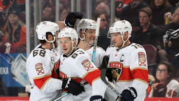PHILADELPHIA, PA - NOVEMBER 13: Evgenii Dadonov #63 of the Florida Panthers celebrates his second period goal against the Philadelphia Flyers with Mike Hoffman #68, Mike Matheson #19, and Aleksander Barkov #16 on November 13, 2018 at the Wells Fargo Center in Philadelphia, Pennsylvania. (Photo by Len Redkoles/NHLI via Getty Images)