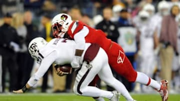 Dec 30, 2015; Nashville, TN, USA; Texas A&M Aggies quarterback Jake Hubenak (7) is sacked by Louisville Cardinals linebacker Devonte Fields (92) during the first half in the 2015 Music City Bowl at Nissan Stadium. Mandatory Credit: Christopher Hanewinckel-USA TODAY Sports