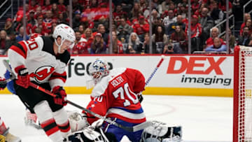 WASHINGTON, DC - JANUARY 11: Blake Coleman #20 of the New Jersey Devils scores a goal against Braden Holtby #70 of the Washington Capitals in the second period at Capital One Arena on January 11, 2020 in Washington, DC. (Photo by Patrick McDermott/NHLI via Getty Images)