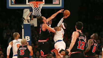 Jan 11, 2013; New York, NY, USA; Chicago Bulls center Joakim Noah (13) keeps New York Knicks small forward Carmelo Anthony (7) from the net during the first quarter at Madison Square Garden. Mandatory Credit: Anthony Gruppuso-USA TODAY Sports
