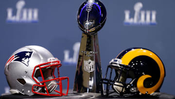 ATLANTA, GA - JANUARY 30: Detail of the Lombardi Trophy and the helmets of the New England Patriots (left) and the Los Angeles Rams prior to NFL Commissioner Roger Goodell speaking during a press conference during Super Bowl LIII Week at the NFL Media Center inside the Georgia World Congress Center on January 30, 2019 in Atlanta, Georgia. (Photo by Mike Zarrilli/Getty Images)