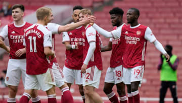 Arsenal's French-born Ivorian midfielder Nicolas Pepe (R) celebrates scoring his team's second goal during the English Premier League football match between Arsenal and Brighton and Hove Albion at the Emirates Stadium in London on May 23, 2021. - - RESTRICTED TO EDITORIAL USE. No use with unauthorized audio, video, data, fixture lists, club/league logos or 'live' services. Online in-match use limited to 120 images. An additional 40 images may be used in extra time. No video emulation. Social media in-match use limited to 120 images. An additional 40 images may be used in extra time. No use in betting publications, games or single club/league/player publications. (Photo by Alastair Grant / POOL / AFP) / RESTRICTED TO EDITORIAL USE. No use with unauthorized audio, video, data, fixture lists, club/league logos or 'live' services. Online in-match use limited to 120 images. An additional 40 images may be used in extra time. No video emulation. Social media in-match use limited to 120 images. An additional 40 images may be used in extra time. No use in betting publications, games or single club/league/player publications. / RESTRICTED TO EDITORIAL USE. No use with unauthorized audio, video, data, fixture lists, club/league logos or 'live' services. Online in-match use limited to 120 images. An additional 40 images may be used in extra time. No video emulation. Social media in-match use limited to 120 images. An additional 40 images may be used in extra time. No use in betting publications, games or single club/league/player publications. (Photo by ALASTAIR GRANT/POOL/AFP via Getty Images)