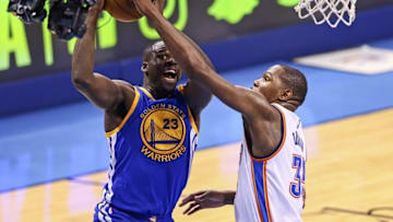 May 22, 2016; Oklahoma City, OK, USA; Golden State Warriors forward Draymond Green (23) shoots as Oklahoma City Thunder forward Kevin Durant (35) defends during the second quarter in game three of the Western conference finals of the NBA Playoffs at Chesapeake Energy Arena. Mandatory Credit: Kevin Jairaj-USA TODAY Sports