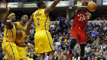 Dec 14, 2015; Indianapolis, IN, USA; Toronto Raptors guard Terrence Ross (31) makes a pass against Indiana Pacers guard Rodney Stuckey (2) at Bankers Life Fieldhouse. Indiana defeats Toronto 106-90. Mandatory Credit: Brian Spurlock-USA TODAY Sports