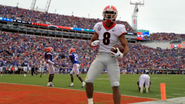 JACKSONVILLE, FLORIDA - NOVEMBER 02: Dominick Blaylock (8) of the Georgia Bulldogs scores a touchdown during a game against the Florida Gators on November 02, 2019 in Jacksonville, Florida. (Photo by Mike Ehrmann/Getty Images)