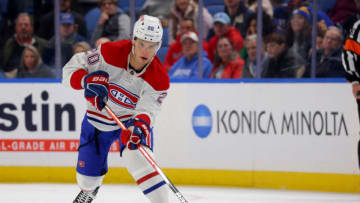 Oct 23, 2023; Buffalo, New York, USA; Montreal Canadiens left wing Juraj Slafkovsky (20) clears the puck up the ice during the third period against the Buffalo Sabres at KeyBank Center. Mandatory Credit: Timothy T. Ludwig-USA TODAY Sports