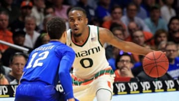 Jan 25, 2016; Coral Gables, FL, USA; Miami Hurricanes guard Ja'Quan Newton (0) is pressured by Duke Blue Devils guard Derryck Thornton (12) during the second half at BankUnited Center. Miami won 80-69. Mandatory Credit: Steve Mitchell-USA TODAY Sports