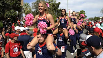 Oct 10, 2015; Tucson, AZ, USA; Arizona Wildcats cheerleaders cheer during the wildcat walk before the game against the Oregon State Beavers at Arizona Stadium. Mandatory Credit: Casey Sapio-USA TODAY Sports