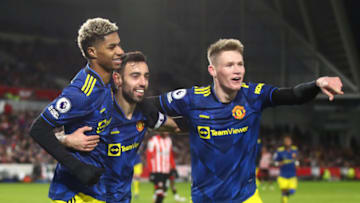 BRENTFORD, ENGLAND - JANUARY 19: Marcus Rashford of Manchester United celebrates scoring their 3rd goal with Bruno Fernandes and Scott McTominay during the Premier League match between Brentford and Manchester United at Brentford Community Stadium on January 19, 2022 in Brentford, England. (Photo by Marc Atkins/Getty Images)