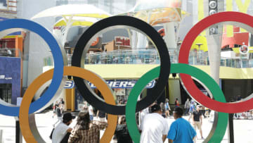 UNIVERSAL CITY, CALIFORNIA - JULY 03: Guests pose at a life-size set of iconic Olympic Rings at the NBC Olympics launch of "Rings Across America" Tour at Universal Studios Hollywood on July 03, 2021 in Universal City, California. (Photo by Amy Sussman/Getty Images)