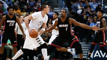 Jan 15, 2016; Denver, CO, USA; Denver Nuggets forward Danilo Gallinari (8) controls the ball against Miami Heat forward Chris Bosh (1) in the third quarter at the Pepsi Center. Mandatory Credit: Isaiah J. Downing-USA TODAY Sports