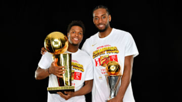 OAKLAND, CA - JUNE 13: Kyle Lowry #7 and Kawhi Leonard #2 of the Toronto Raptors pose for a portrait with the Larry O'Brien Trophy after winning Game Six of the 2019 NBA Finals against the Golden State Warriors on June 13, 2019 at ORACLE Arena in Oakland, California. NOTE TO USER: User expressly acknowledges and agrees that, by downloading and/or using this photograph, user is consenting to the terms and conditions of Getty Images License Agreement. Mandatory Copyright Notice: Copyright 2019 NBAE (Photo by Jesse D. Garrabrant/NBAE via Getty Images)