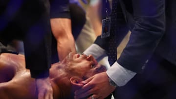 May 7, 2022; Phoenix, Arizona, USA; Tony Ferguson is stablized after being knocked out by Michael Chandler during UFC 274 at Footprint Center. Mandatory Credit: Mark J. Rebilas-USA TODAY Sports