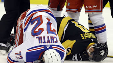 Jan 24, 2021; Pittsburgh, Pennsylvania, USA; New York Rangers center Filip Chytil (72) and Pittsburgh Penguins center Evan Rodrigues (9) lay on the ice after a collision during the second period at the PPG Paints Arena. Pittsburgh won 3-2. Mandatory Credit: Charles LeClaire-USA TODAY Sports