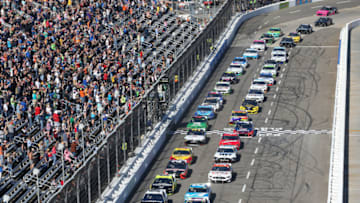 MARTINSVILLE, VIRGINIA - OCTOBER 27: Denny Hamlin, driver of the #11 FedEx Freight Toyota, takes the checkered flag to start the Monster Energy NASCAR Cup Series First Data 500 at Martinsville Speedway on October 27, 2019 in Martinsville, Virginia. (Photo by Brian Lawdermilk/Getty Images)