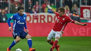 MUNICH, GERMANY - MARCH 01: Benjamin Stambouli of Schalke and Joshua Kimmich of Bayern Muenchen battle for the ball during the DFB Cup quarter final between Bayern Muenchen and FC Schalke 04 at Allianz Arena on March 1, 2017 in Munich, Germany. (Photo by TF-Images/Getty Images)