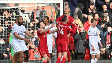Liverpool's Brazilian midfielder Fabinho (2R) celebrates scoring the opening goal during the English Premier League football match between Liverpool and Brentford at Anfield in Liverpool, north west England on January 16, 2022. - - RESTRICTED TO EDITORIAL USE. No use with unauthorized audio, video, data, fixture lists, club/league logos or 'live' services. Online in-match use limited to 120 images. An additional 40 images may be used in extra time. No video emulation. Social media in-match use limited to 120 images. An additional 40 images may be used in extra time. No use in betting publications, games or single club/league/player publications. (Photo by Paul ELLIS / AFP) / RESTRICTED TO EDITORIAL USE. No use with unauthorized audio, video, data, fixture lists, club/league logos or 'live' services. Online in-match use limited to 120 images. An additional 40 images may be used in extra time. No video emulation. Social media in-match use limited to 120 images. An additional 40 images may be used in extra time. No use in betting publications, games or single club/league/player publications. / RESTRICTED TO EDITORIAL USE. No use with unauthorized audio, video, data, fixture lists, club/league logos or 'live' services. Online in-match use limited to 120 images. An additional 40 images may be used in extra time. No video emulation. Social media in-match use limited to 120 images. An additional 40 images may be used in extra time. No use in betting publications, games or single club/league/player publications. (Photo by PAUL ELLIS/AFP via Getty Images)