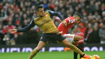 MANCHESTER, ENGLAND - FEBRUARY 28: Alexis Sanchez of Arsenal is challenged by Jesse Lingard of Man Utd during the Barclays Premier League match between Manchester United and Arsenal at Old Trafford on February 28, 2016 in Manchester, United Kingdom. (Photo by David Price/Arsenal FC via Getty Images)