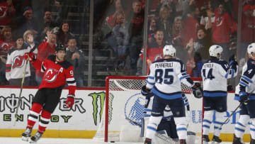 NEWARK, NJ- October 04: Taylor Hall #9 of the New Jersey Devils celebrates Blake Coleman's (not pictured) second period goal during the game against the Winnipeg Jets on October 4, 2019 at Prudential Center in Newark, New Jersey. (Photo by Andy Marlin/NHLI via Getty Images)
