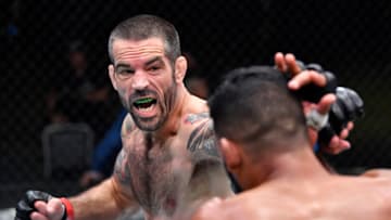 LAS VEGAS, NEVADA - JUNE 19: (L-R) Matt Brown punches Dhiego Lima of Brazil in a welterweight bout during the UFC Fight Night event at UFC APEX on June 19, 2021 in Las Vegas, Nevada. (Photo by Chris Unger/Zuffa LLC)