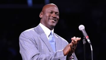 Dec 21, 2013; Charlotte, NC, USA; Charlotte Bobcats owner Michael Jordan unveils the new Charlotte Hornets logo at halftime during the game against the Utah Jazz at Time Warner Cable Arena. Mandatory Credit: Sam Sharpe-USA TODAY Sports