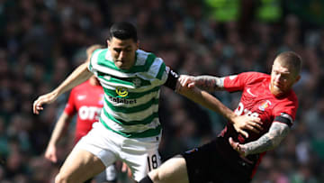 GLASGOW, SCOTLAND - APRIL 27: GLASGOW, SCOTLAND - APRIL 27: Tom Rogic of Celtic vies with Alan Power of Kilmarnock during the Scottish Premier Leagur match between Celtic and Kilmarnock at Celtic Park on April 27, 2019 in Glasgow, Scotland. (Photo by Ian MacNicol/Getty Images)