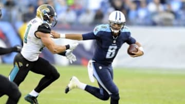 Dec 6, 2015; Nashville, TN, USA; Tennessee Titans quarterback Marcus Mariota (8) carrie the ball during the second half against the Jacksonville Jaguars at Nissan Stadium. The Titans won 42-39. Mandatory Credit: Christopher Hanewinckel-USA TODAY Sports