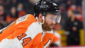 Sep 28, 2021; Philadelphia, Pennsylvania, USA; Philadelphia Flyers center Sean Couturier (14) against the New York Islanders at Wells Fargo Center. Mandatory Credit: Eric Hartline-USA TODAY Sports