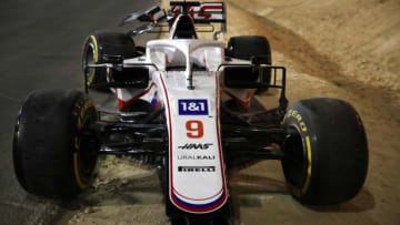 BAHRAIN, BAHRAIN - MARCH 28: The abandoned car of Nikita Mazepin of Russia and Haas F1 is seen at the side of the track after a colllision earlier in the race during the F1 Grand Prix of Bahrain at Bahrain International Circuit on March 28, 2021 in Bahrain, Bahrain. (Photo by Bryn Lennon/Getty Images)