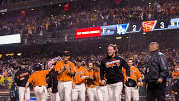 Apr 8, 2016; San Francisco, CA, USA; San Francisco Giants players celebrate with shortstop Brandon Crawford (35) solo home run against the Los Angeles Dodgers to end the game in the tenth inning at AT&T Park. The Giants won 3-2. Mandatory Credit: John Hefti-USA TODAY Sports