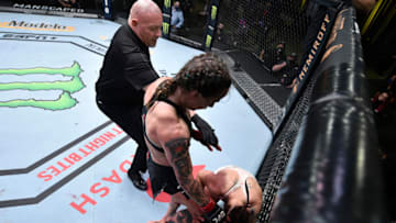 LAS VEGAS, NEVADA - SEPTEMBER 19: (L-R) Jessica-Rose Clark of Australia knees Sarah Alpar in their bantamweight bout during the UFC Fight Night event at UFC APEX on September 19, 2020 in Las Vegas, Nevada. (Photo by Chris Unger/Zuffa LLC)