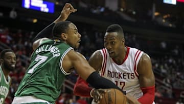 Nov 16, 2015; Houston, TX, USA; Houston Rockets center Dwight Howard (12) dribbles against Boston Celtics center Jared Sullinger (7) in the second half at Toyota Center. Celtics won 111 to 95. Mandatory Credit: Thomas B. Shea-USA TODAY Sports
