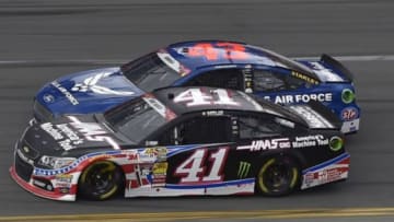 Jul 6, 2014; Daytona Beach, FL, USA; NASCAR Sprint Cup Series drivers Kurt Busch (41) and Aric Almirola (43) battle for the lead during the Coke Zero 400 at Daytona International Speedway. Mandatory Credit: Jasen Vinlove-USA TODAY Sports