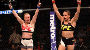 LAS VEGAS, NV - MARCH 05: (L) Valentina Shevchenko and Amanda Nunes raise their hands after their bantamweight bout during the UFC 196 event inside MGM Grand Garden Arena on March 5, 2016 in Las Vegas, Nevada. (Photo by Josh Hedges/Zuffa LLC/Zuffa LLC via Getty Images)