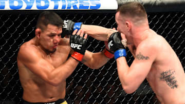 CHICAGO, ILLINOIS - JUNE 09: (R-L) Colby Covington punches Rafael Dos Anjos of Brazil in their interim welterweight title fight during the UFC 225 event at the United Center on June 9, 2018 in Chicago, Illinois. (Photo by Josh Hedges/Zuffa LLC/Zuffa LLC via Getty Images)