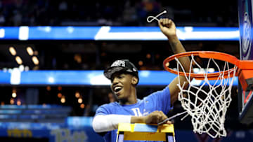 CHARLOTTE, NORTH CAROLINA - MARCH 16: RJ Barrett #5 of the Duke Blue Devils cuts down a piece of the net after defeating the Florida State Seminoles 73-63 in the championship game of the 2019 Men's ACC Basketball Tournament at Spectrum Center on March 16, 2019 in Charlotte, North Carolina. (Photo by Streeter Lecka/Getty Images)