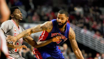 Apr 2, 2016; Chicago, IL, USA;Detroit Pistons forward Marcus Morris (13) drives to the basket against Chicago Bulls guard Justin Holiday (7) in the 1st quarter at the United Center. Mandatory Credit: Matt Marton-USA TODAY Sports