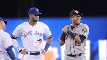 TORONTO, ON - SEPTEMBER 24: Lourdes Gurriel Jr. #13 of the Toronto Blue Jays meets with brother Yuli Gurriel #10 of the Houston Astros before the start of their MLB game at Rogers Centre on September 24, 2018 in Toronto, Canada. (Photo by Tom Szczerbowski/Getty Images)