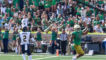 Sep 17, 2022; South Bend, Indiana, USA; Notre Dame Fighting Irish running back Chris Tyree (25) scores a touchdown in front of California Bears safety Daniel Scott (2) in the second quarter at Notre Dame Stadium. Mandatory Credit: Matt Cashore-USA TODAY Sports