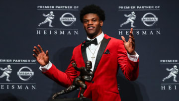 NEW YORK CITY, NY - DECEMBER 10: 2016 Heisman Trophy winner University of Louisville quarterback Lamar Jackson (4) with the Heisman Trophy after winning the 81st Annual Heisman Trophy press conference on December 10, 2016, at the Marriott Marquis in New York City. (Photo by Rich Graessle/Icon Sportswire via Getty Images)