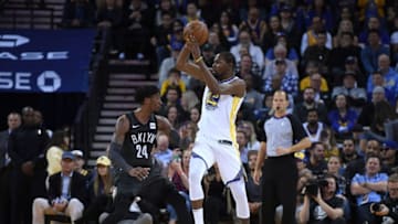 OAKLAND, CA - MARCH 06: Kevin Durant #35 of the Golden State Warriors looks to pass over the top of Rondae Hollis-Jefferson #24 of the Brooklyn Nets during an NBA basketball game at ORACLE Arena on March 6, 2018 in Oakland, California. NOTE TO USER: User expressly acknowledges and agrees that, by downloading and or using this photograph, User is consenting to the terms and conditions of the Getty Images License Agreement. (Photo by Thearon W. Henderson/Getty Images)