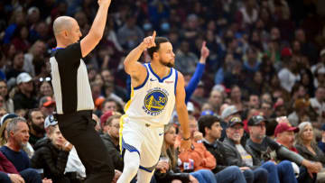 CLEVELAND, OHIO - NOVEMBER 05: Referee Marat Kogut #32 signals a field goal as Stephen Curry #30 of the Golden State Warriors celebrates after scoring against the Cleveland Cavaliers during the first quarter at Rocket Mortgage Fieldhouse on November 05, 2023 in Cleveland, Ohio. NOTE TO USER: User expressly acknowledges and agrees that, by downloading and or using this photograph, User is consenting to the terms and conditions of the Getty Images License Agreement. (Photo by Jason Miller/Getty Images)
