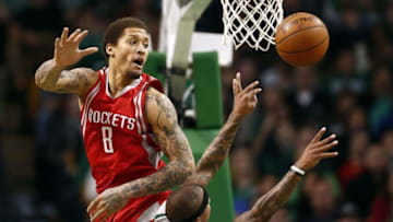 Mar 11, 2016; Boston, MA, USA; Boston Celtics guard Isaiah Thomas (4) shoots the ball against Houston Rockets forward Michael Beasley (8) during the first half at TD Garden. Mandatory Credit: Mark L. Baer-USA TODAY Sports