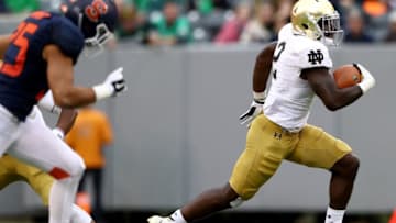 EAST RUTHERFORD, NJ - OCTOBER 01: Dexter Williams #2 of the Notre Dame Fighting Irish breaks away and runs the ball in for a touchdown in the second half against the Syracuse Orange at MetLife Stadium on October 1, 2016 in East Rutherford, New Jersey.The Notre Dame Fighting Irish defeated the Syracuse Orange 50-33. (Photo by Elsa/Getty Images)