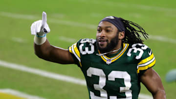 GREEN BAY, WISCONSIN - JANUARY 16: Aaron Jones #33 of the Green Bay Packers reacts after defeating the Los Angeles Rams 32-18 in the NFC Divisional Playoff game at Lambeau Field on January 16, 2021 in Green Bay, Wisconsin. (Photo by Stacy Revere/Getty Images)