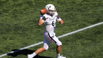 Cincinnati Bearcats quarterback Ben Bryant scrambles. USA Today.