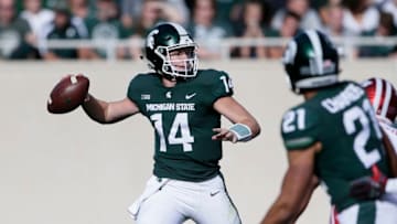 EAST LANSING, MI - OCTOBER 21: Quarterback Brian Lewerke #14 of the Michigan State Spartans passes the ball against the Indiana Hoosiers during the first half at Spartan Stadium on October 21, 2017 in East Lansing, Michigan. (Photo by Duane Burleson/Getty Images)