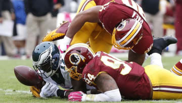 Oct 4, 2015; Landover, MD, USA; Washington Redskins defensive end Stephen Paea (90), Philadelphia Eagles wide receiver Nelson Agholor (17), and Redskins linebacker Preston Smith (94) attempt to recover an Eagles fumble in the second quarter at FedEx Field. Mandatory Credit: Geoff Burke-USA TODAY Sports