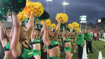 Aug 30, 2014; Eugene, OR, USA; Oregon Ducks cheerleaders cheer after a touchdown against South Dakota Coyotes at Autzen Stadium. Mandatory Credit: Jaime Valdez-USA TODAY Sports