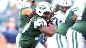 Dec 13, 2015; East Rutherford, NJ, USA; New York Jets running back Chris Ivory (33) runs the ball against the Tennessee Titans during the second quarter at MetLife Stadium. Mandatory Credit: Brad Penner-USA TODAY Sports